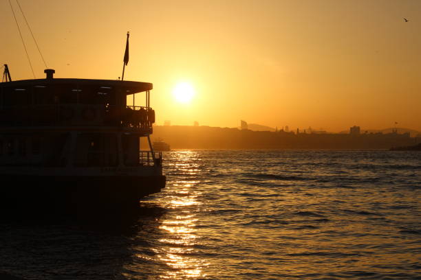 istock tourist boats in the Bosphorus during sunrise 1036654834
