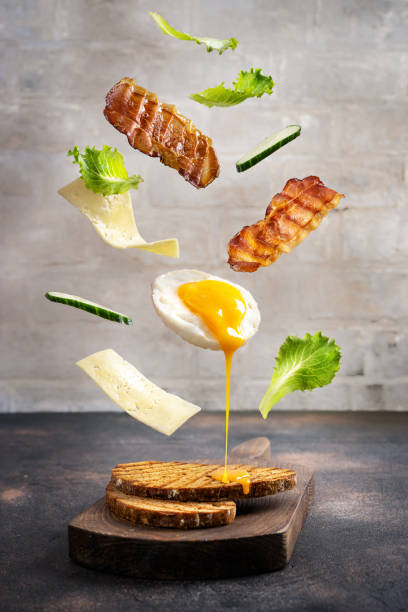 istock Breakfast sandwich in levitation above cutting board 1036655034