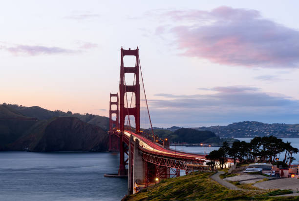 golden gate bridge at sunset, san francisco, california - beach architecture golden gate bridge night imagens e fotografias de stock