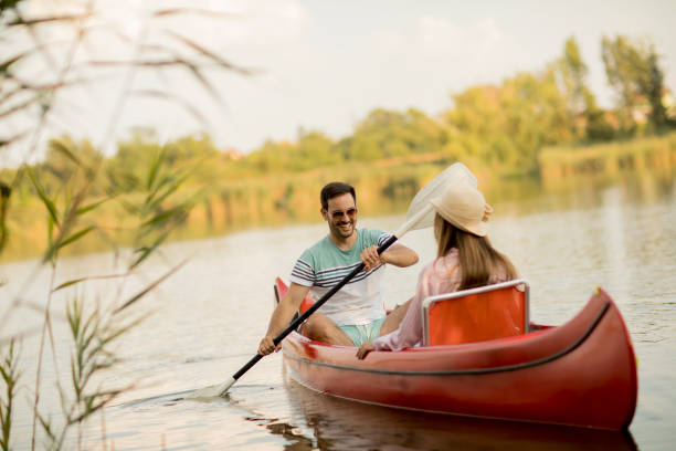 istock Loving couple rowing on the lake 1036656686
