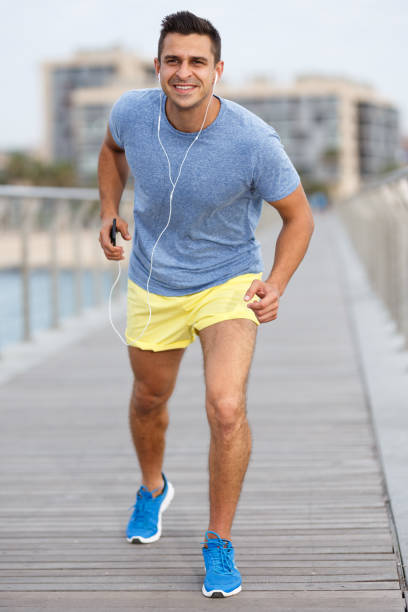 istock Man listening music on workout 1036660376