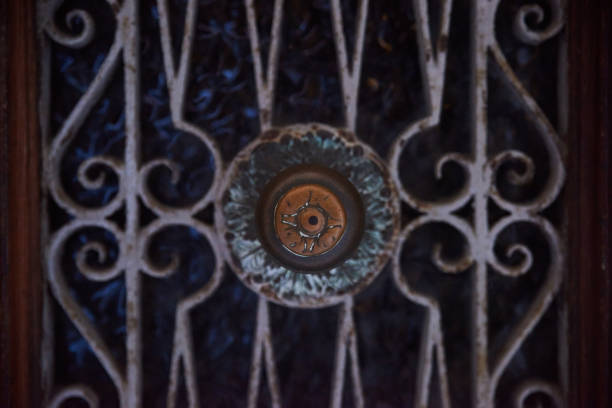 Chambery; Auvergne-Rhône-Alps; Savoy; France - July 7, 2019: View of a wrought-iron grate under an arch in the historic center, in summer.