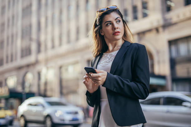 istock Business woman using mobile phone 1036692554
