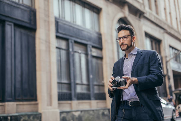 istock Photographer on the street 1036693144