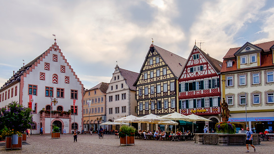 Tourists resting in the old town of Bad Mergentheim, a spa town since 1926. The town is part of the famous Romantic Road (Romantische Straße), the \