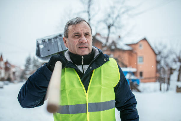 istock Senior Man After Shoveling Parking Lot 1036708098
