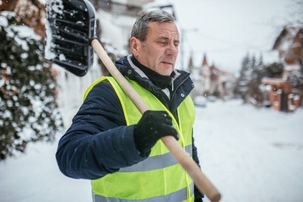 istock Senior Man After Shoveling Snowy Parking 1036708326