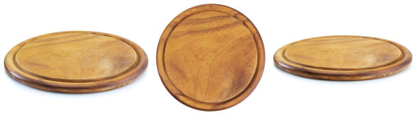 Round wooden plate with three views. Isolated on white background.