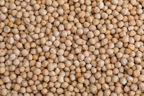 Texture of raw chickpeas (legume) Texture of raw chickpeas (legume) chick pea photos stock pictures, royalty-free photos & images