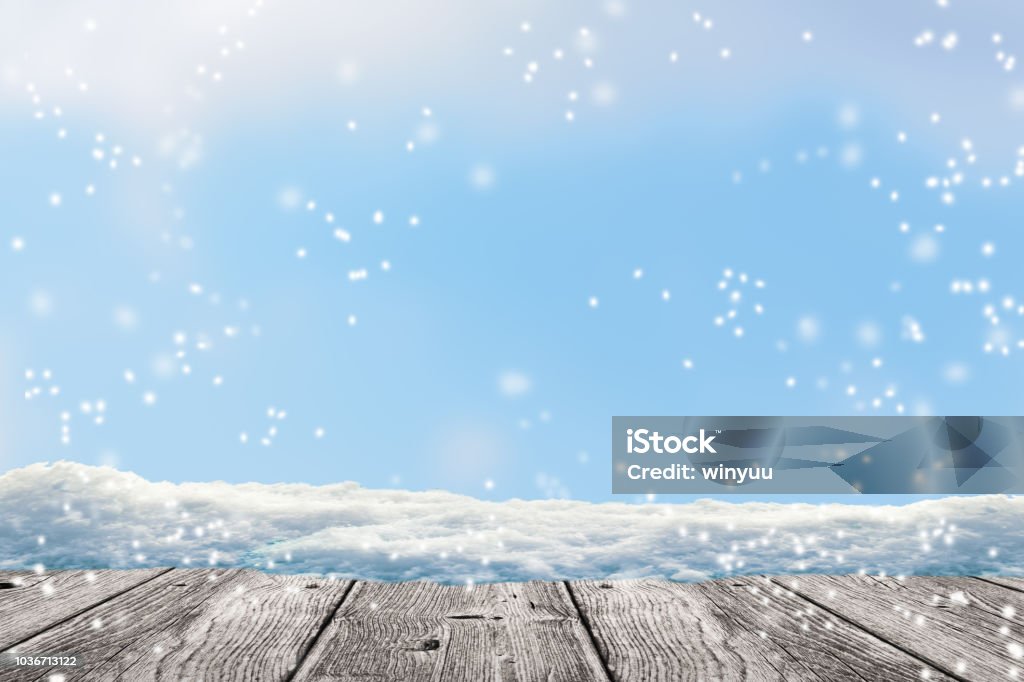wood in front of winter background grey wooden floor in front of a snow winter background Snow Stock Photo