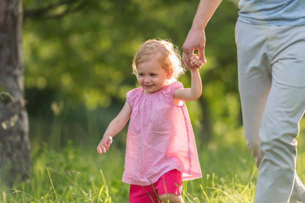 istock Father and daughter in park 1036718372