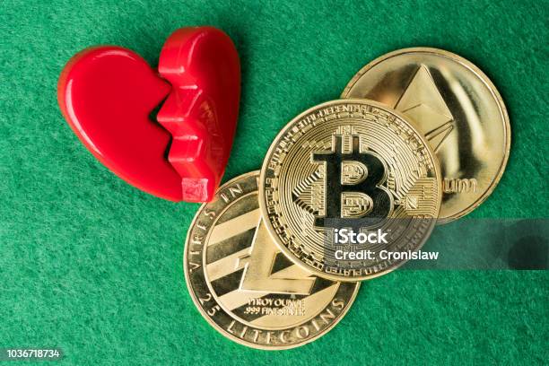 Gold Physical Bitcoin Litecoin And Ethereum Coins With Broken Heart Stock Photo - Download Image Now