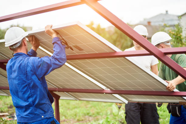 installation of stand-alone exterior photo voltaic panels system. renewable green energy generation. - voltaic imagens e fotografias de stock