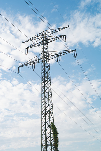 110 kV High Voltage Pylon on a Blue Sky Dotted with Clouds - Two Ground Wires