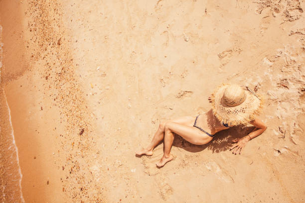 istock Woman at tropical beach 1036725718