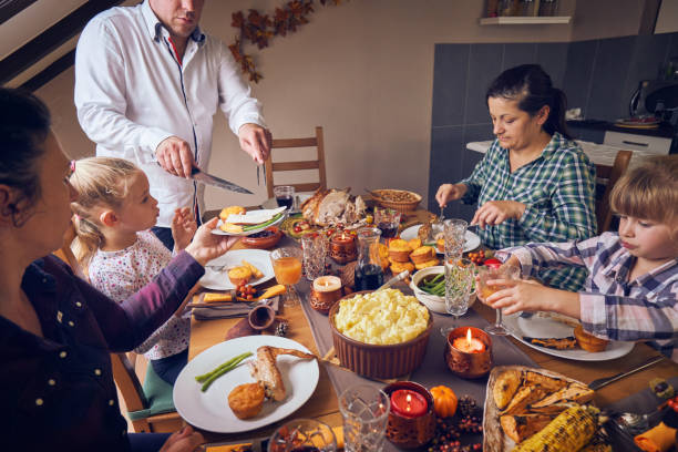 istock Family Having Traditional Holiday Stuffed Turkey Dinner 1036728862