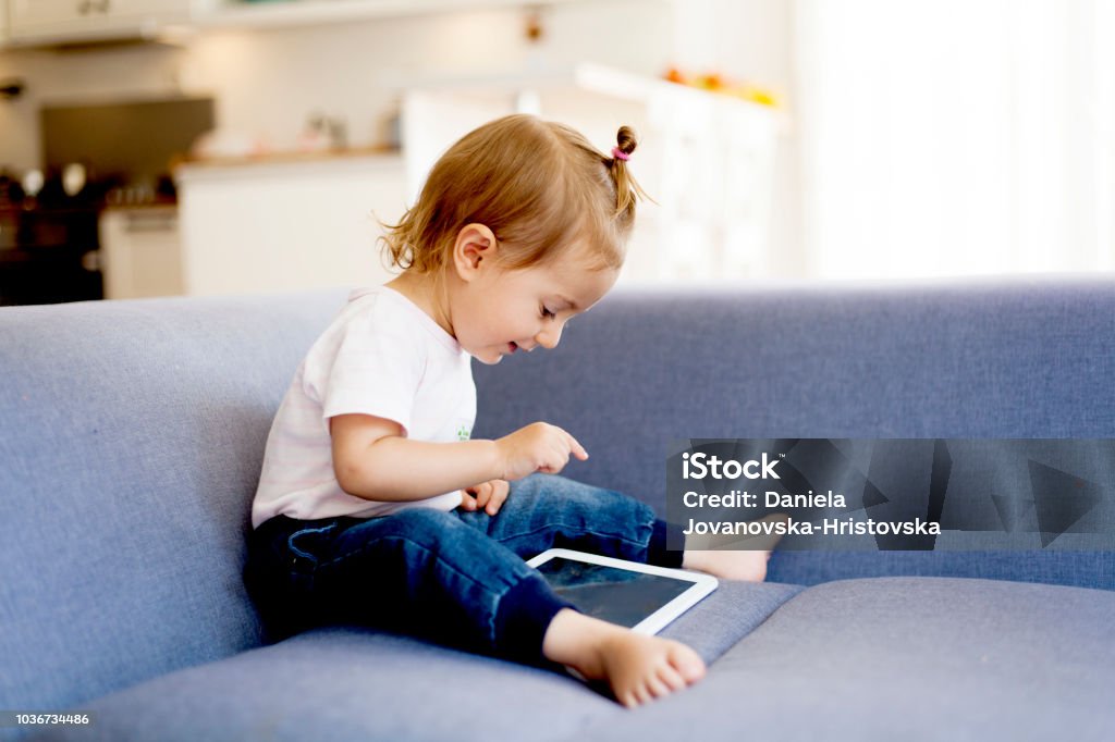 cute girl using digital tablet Digital Tablet Stock Photo