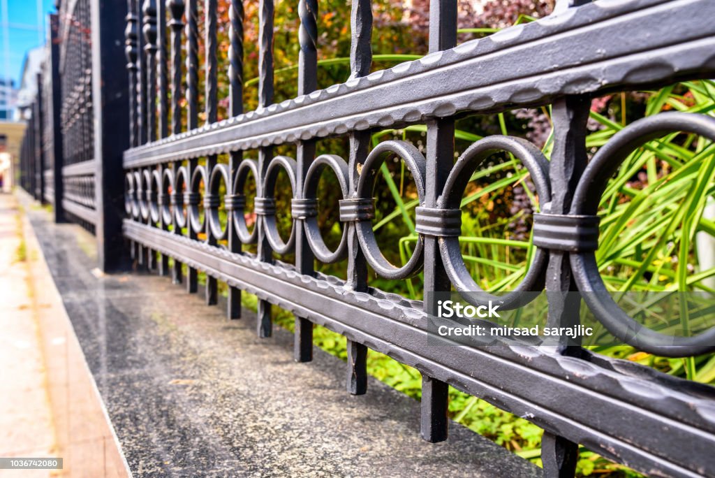 fence wrought iron fence close up Fence Stock Photo