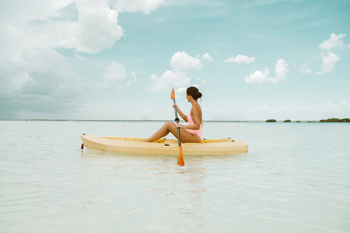 Woman using kayak in Bacalar