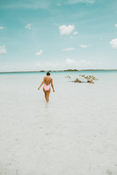 istock Woman walking in a lagoon 1036743174