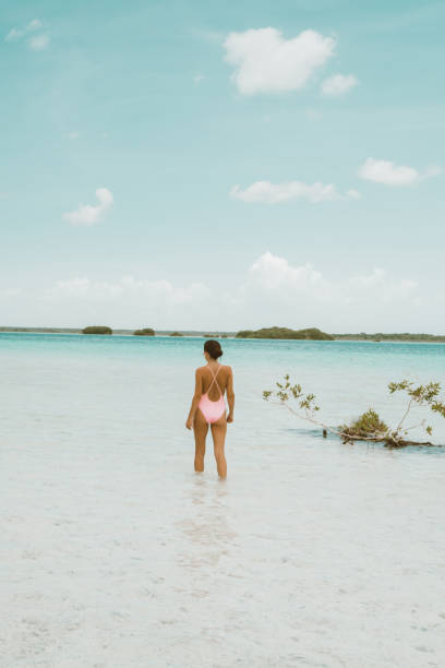 istock Woman walking in a lagoon 1036745182