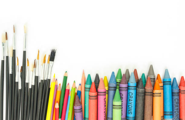 istock paintbrush, crayon, pencil multicolor on white background. 1036745878