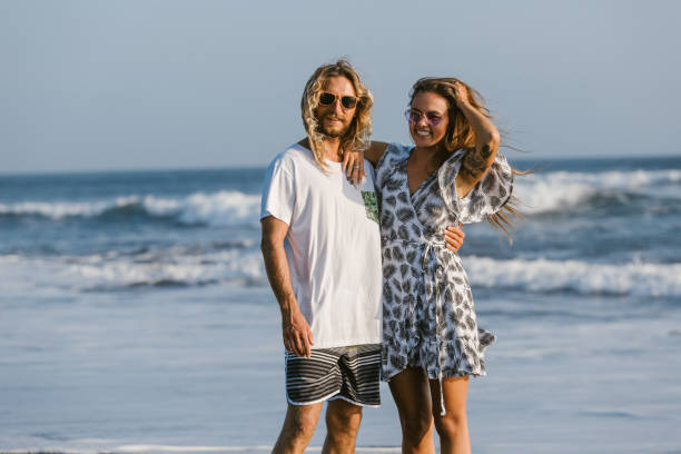 istock couple standing and hugging on beach in bali, indonesia 1036748242