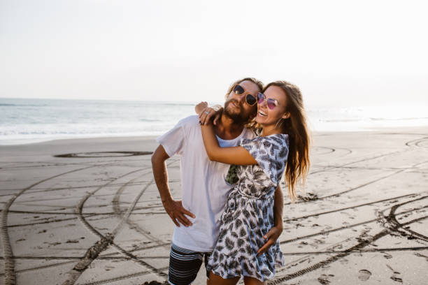 istock happy couple hugging on beach in bali, indonesia 1036748270