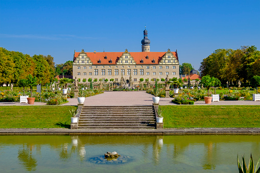 Weikersheim Castle was built in the 12th century and is surrounded by a large Baroque garden with many statues. It is part of the famous Romantic Road (Romantische Straße), the \
