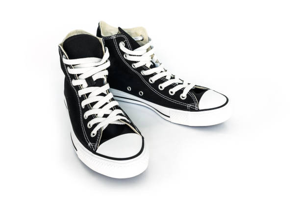 istock black sneakers classic vintage shoe on white background 1036762780