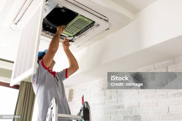 Air Conditioner Install Stock Photo - Download Image Now - Air Conditioner, Repairing, Office