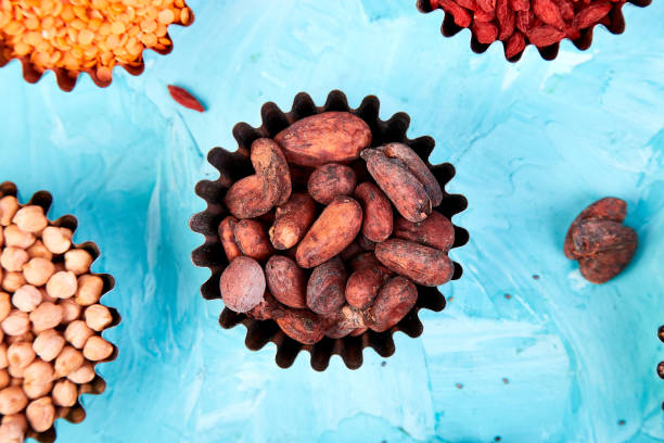 various superfoods in small bowl on blue background - quinoa sesame chia flax seed imagens e fotografias de stock