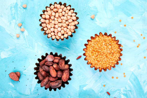 various superfoods in small bowl on blue background - quinoa sesame chia flax seed imagens e fotografias de stock