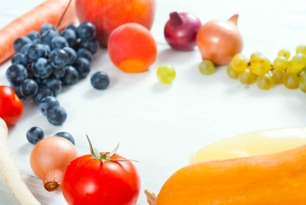 istock Fruits and vegetables on white wood 1036767578