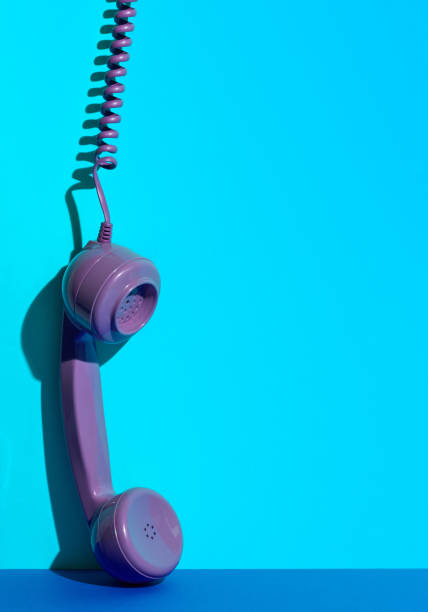 istock Vintage Purple Headphone Hanging on a Blue Background Concept Idea 1036774710