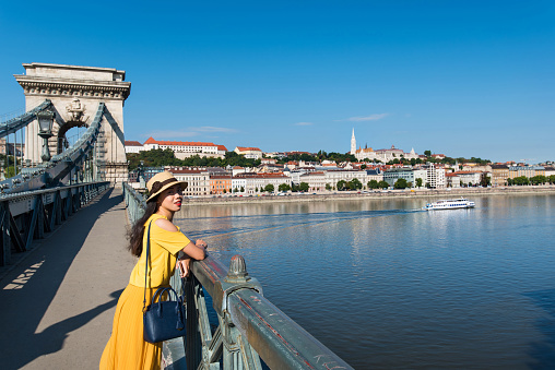 Female tourist enjoying Budapest view from the chain bridge