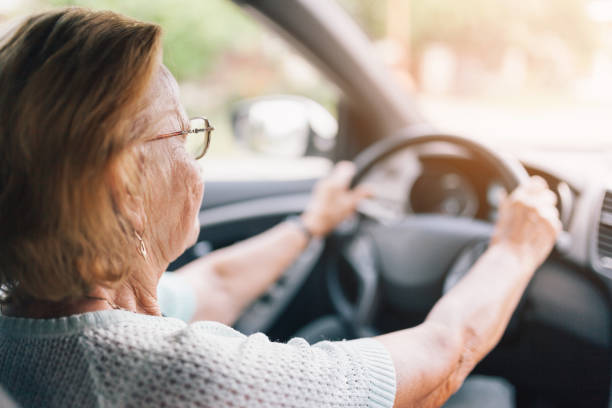 istock Elderly woman behind the steering wheel 1036778010