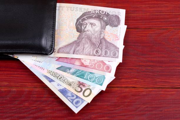 istock Old money from Sweden in the black wallet 1036779042
