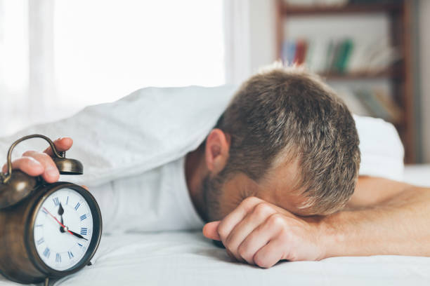 istock Man finding it difficult to wake up in the morning 1036779840