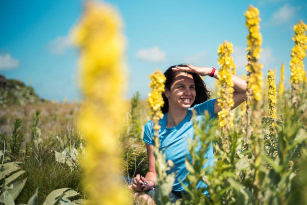 istock Brunette among field flowers 1036784998