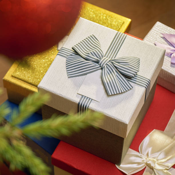 istock Gift boxes standing under a Christmas tree in New Year Eve 1036795514