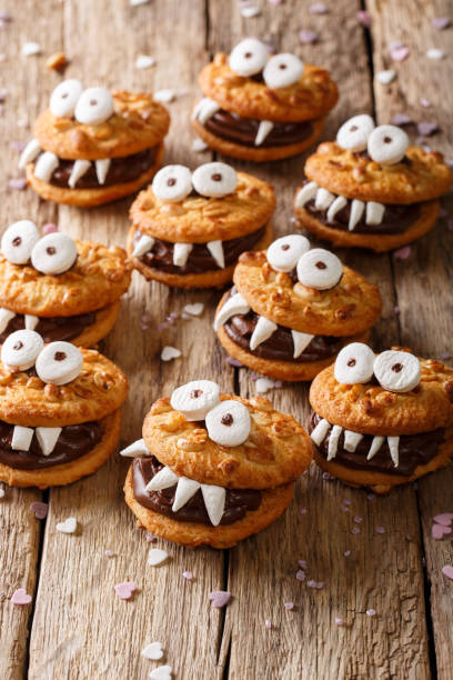 istock Peanuts chocolate cookies monsters on a table for Halloween. vertical 1036804582