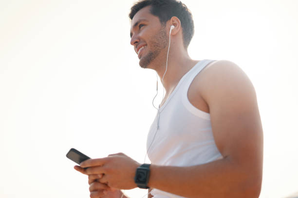 istock Handsome, happy, smiling young man using smart phone 1036804984