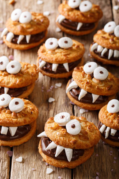 istock Halloween background: cookies monsters close-up. vertical 1036811158