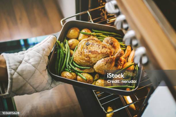 Cook Taking Ready Chicken From The Oven Stock Photo - Download Image Now - Cooking, Chicken Meat, Oven