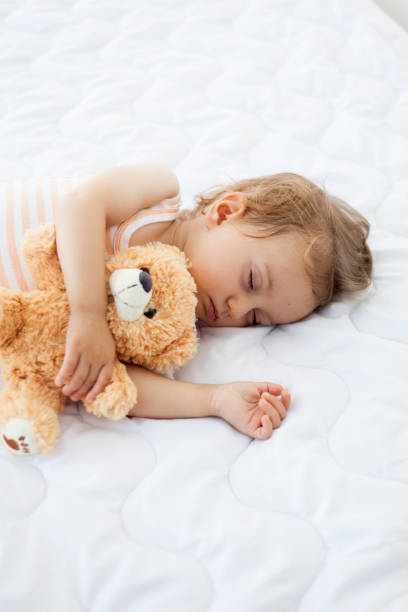 istock baby girl sleeping 1036823638