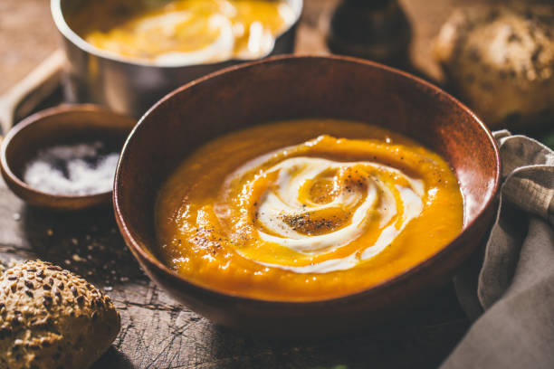 istock Autumn pumpkin creamy soup in bowls 1036826262