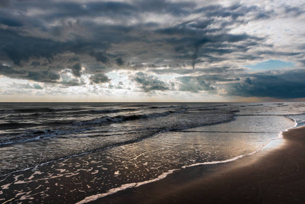 istock Overcast weather with cumulus clouds on the sea 1036830654