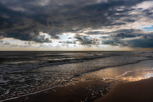 istock Overcast weather with cumulus clouds on the sea 1036830896