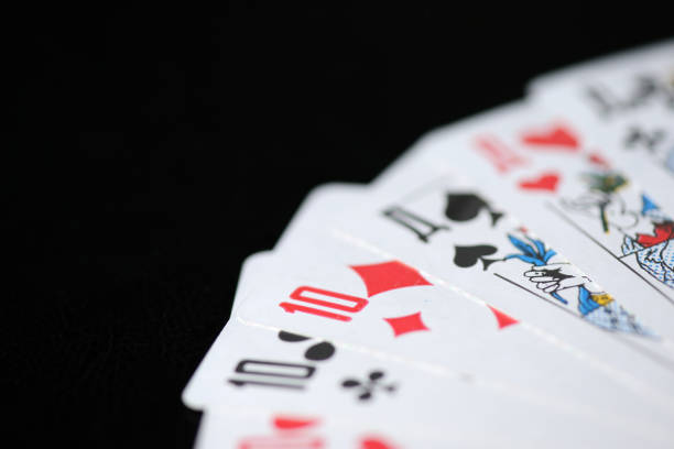 istock Playing cards on a dark background close up 1036840264
